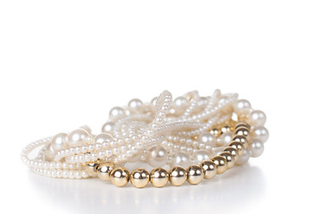 jewelry made ​​of gold and white pearls