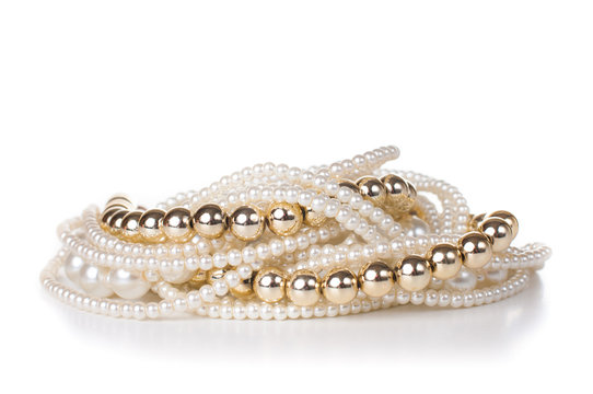jewelry made ​​of gold and white pearls