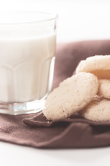 Cookies and milk in glass on napkin