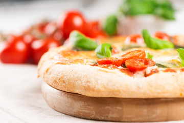 italian pizza on tablecloth with tomatoes copy space
