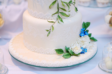 White wedding cake decorated with flowers