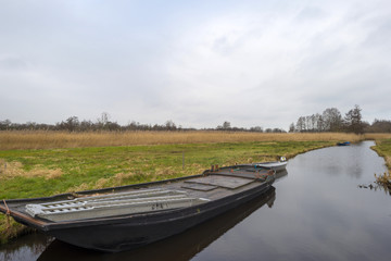 Boat in a canal through the countryside