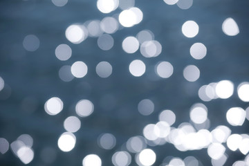 Out of focus sparkling water during sunset