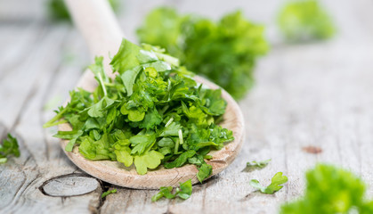 Parsley on a wooden spoon