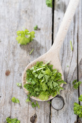 Cutted Parsley on a wooden spoon