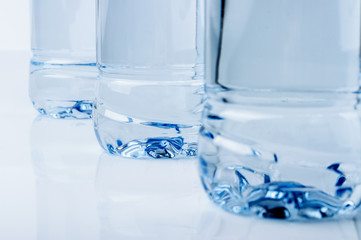 Studio shot of three bottle bottoms