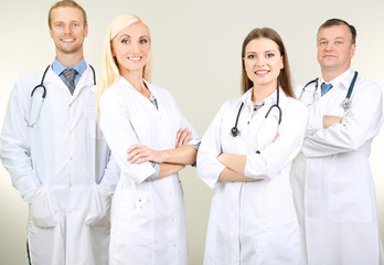 Medical workers on grey background