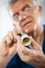Fototapeta premium Repairing Old Bulb socket