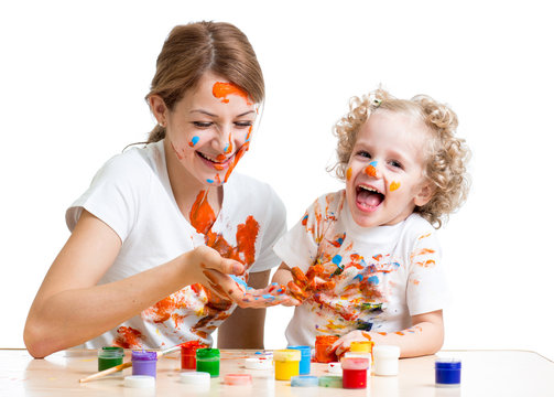 funny mother and kid girl painting together