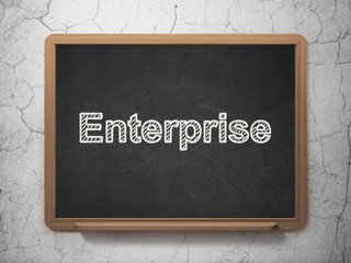 Business concept: Enterprise on chalkboard background