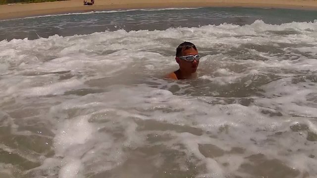 Bodysurfing in big waves.