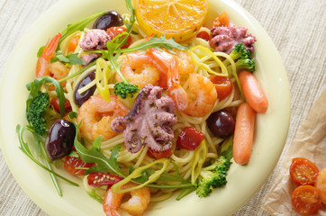 Seafood spaghetti pasta dish with octopus and shrimps