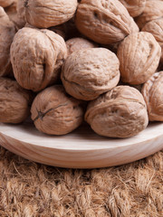 Walnuts on a wooden plate