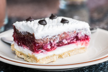Close-up of delicious raspberry cake isolated on white