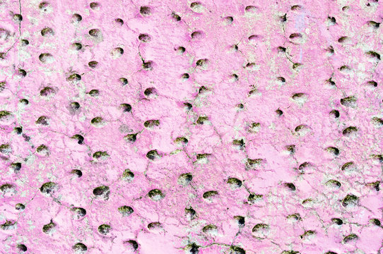 pink holed wall surface