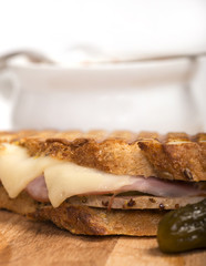 Delicious ham, pork and swiss cheese panini with vegetable soup