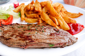 steak beef meat with tomato and french fries
