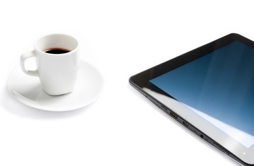 cup of coffee near a tablet pc, concept of new technology