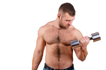 Naklejka premium Muscular guy doing exercises with dumbbells on a white