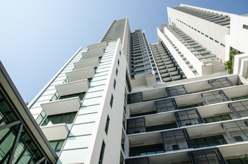Modern residential condominium with clear blue sky
