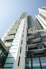 Modern residential condominium with clear blue sky