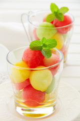 The dessert salad of watermelon and cantaloupe with honey.