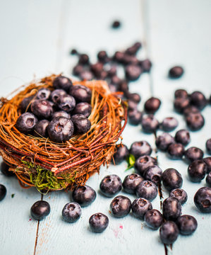 Blueberries in a basket on wooden background