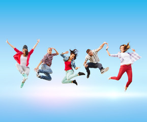 Fototapeta na wymiar group of teenagers jumping