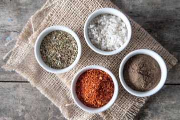 pepper, oregano and cooking salt in bowls