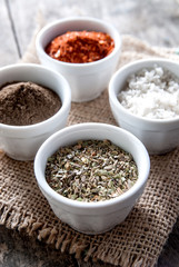 pepper, oregano and cooking salt in bowls