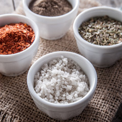 pepper, oregano and cooking salt in bowls