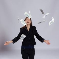Young long-haired woman throw money