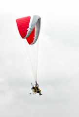 Man with paramotor in the sky