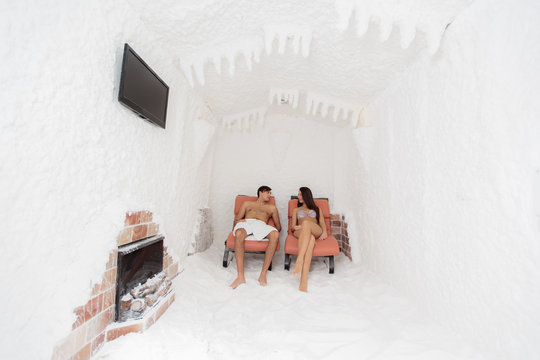Young couple relaxing in the salt room