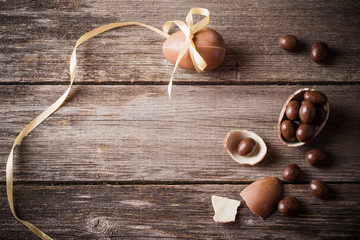 Chocolate Easter Eggs Over Wooden Background