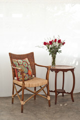 Rattan chair and roses