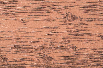 Old weathered plywood surface with faded paint as background