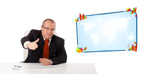 Businessman sitting at desk with copy space