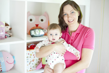 Mother and baby in playroom - 61639341