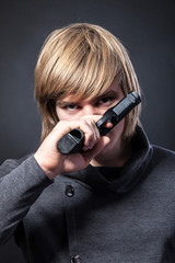 Aiming. Serious man with a gun