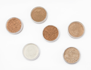 Loose cosmetic powder in jars