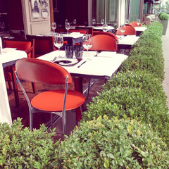 Street view of a coffee terrace with tables