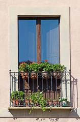 Fototapeta na wymiar Old italian balcony with flowers.