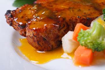 Grilled steak meat with sauce and vegetable