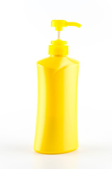 Yellow bottle pump isolated on white background