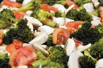 fresh vegetables background, broccoli, tomatoes and mushrooms