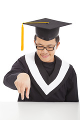 smiling  graduating student focus his fingers to catch