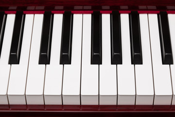 ebony and ivory keys of red piano