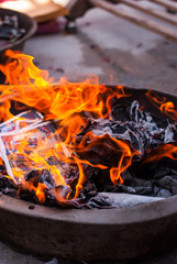 Burning paper for Hungry Ghost Chinese Festival