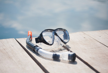 snorkel equipment in front of water